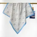 Elegant floral 100% cotton square scarf with a blue border hanging on a gold bar - RY-20