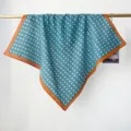 Detailed view of a vintage teal floral cotton square scarf with orange border - RY-44