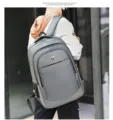 Detailed back view of a grey large capacity casual backpack for travel and business use. - 09 / Gray