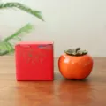 Ceramic orange persimmon-shaped candy jar with a matching red decorative gift box for weddings - Persimmon Candy Jar - Color Box Pack