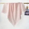 Detailed view of a pink vintage floral print cotton square scarf draped over a gold bar - RY-45