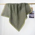 Detailed view of an olive green cotton square scarf with geometric floral print - RY-47