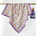 Detailed view of 100% cotton square scarf featuring a vibrant purple floral print pattern - RY-32
