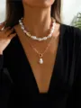 Close-up view of elegant double layered baroque pearl necklace on a female model's neck - Baroque Pearl Link Layered Necklace (Gold 2Pcs A) / Two-Piece Set / Gold