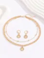 Set collana a doppio strato e orecchini dorati con ciondolo albero della vita in cristallo. - Oro