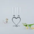 Detailed view of elegant heart-shaped crystal champagne glasses for wedding gifts - Silver