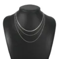 Silver layered necklace set with flat snake chain and twisted rope chains on black display bust - Snake & Rope Chain 3-Piece Set / Silver
