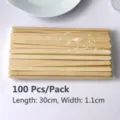 Close-up of a pack of 100 flat bamboo sticks, 30cm long and 1.1cm wide, detail view - 100 Pieces Set