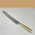 Professional stainless steel cake knife with elegant gold handle and serrated blade for bread - Knife / Gold