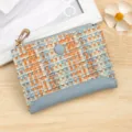 Stylish colorful woven leather women's short wallet with blue trim and gold zipper closure - Blue