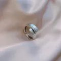 Close-up detail of a vintage silver open ring with 'soulmate' engraving on silk - Adjustable Open / soulmate Lettering Style (J0022) / Antique Silver