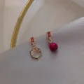 Elegant asymmetric stud earrings with hexagon frame and magenta bead - Hexagonal Bead Asymmetric Style (E0099)