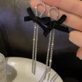 Elegant black velvet bow earrings with long rhinestone tassels in silver plating. - Black Velvet Bowknot Tassel Style (E1352)