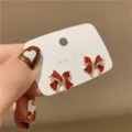 Sparkling red crystal bow-tie stud earrings for women on a white background card - Red Rhinestone Bowknot Style (E1221) / Red (E1221)