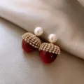 Whimsical red acorn-shaped earrings featuring sparkling rhinestones and elegant white pearls - Red Berry Pearl Rhinestone Style (E1150)
