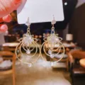 Trendy gold-tone dangling earrings featuring a crystal flower and nested concentric circles - Gold Floral Multi-Layer Circle Style (E1454)