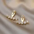 Elegant gold-toned curved ear jacket earrings with sparkling clear cubic zirconia - Gold Curved Rhinestone Ear Jacket Style (E1755)