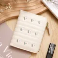 Cream short wallet for women featuring delicate floral embroidery and a sturdy metal zipper - White