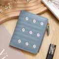 Light blue women's short wallet with small flower embroidery and zipper closure - Blue