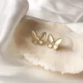 Elegant Korean style butterfly-shaped stud earrings with a soft champagne cat eye finish. - Butterfly Cat's Eye Style (E0728)