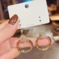 Chic gold-tone multi-hoop earrings with rhinestone pavé ball and S925 silver needle. - 多环交织球形款式(E1327)