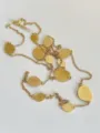 Detailed view showing brushed gold discs on a long chain necklace against white background - Long Necklace / Brushed Gold