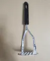 Stainless steel potato masher with black handle for kitchen cooking and mashing vegetables. - Potato Masher (Flat Wire + Mirror Polish Handle)