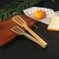 Detailed view of gold stainless steel food tongs with size markings 23.5cm by 5.5cm - Three-Hole Drainage Style (C) / 23.5cm / Gold