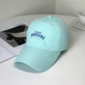 Close-up detail of a mint green baseball cap featuring Paris Awesome embroidery text - Paris Awesome Style / Adult 55-58cm / Light Green