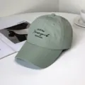 Close-up detail of black New York embroidery on a sage green quick-dry fashion baseball cap - New York Style / Adult 55-58cm / Green