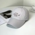 Close-up detail of a stylish light gray baseball cap with New York letter embroidery - New York Style / Adult 55-58cm / Gray