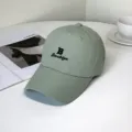 Detailed view of light green quick-dry baseball cap with black Brooklyn embroidery. - Brooklyn Style / Adult 55-58cm / Green
