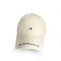 Detailed macro view of a vintage beige baseball cap with blue embroidery and distressed brim - Heart Beige / Adult 56-60cm