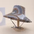 Side view of a wide-brim sun hat featuring tribal geometric patterns and a chin strap - Adult 55-58cm / Gray and Khaki Geometric Print (18)