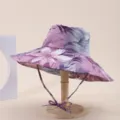 Macro view of purple floral print wide-brimmed sun hat on a wooden display stand - Adult 55-58cm / Light Purple Floral Print (21)