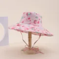 Pink wide-brim sun hat featuring colorful abstract dots on a wooden display stand. - Adult 55-58cm / Light Pink Colorful Polka Dot Print (25)