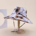 Abstract ink print bucket hat with wide brim and chin strap on wooden hat stand - Adult 55-58cm / Blue White Orange Brown Ink Print (31)