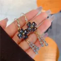 Sparkly rhinestone four-leaf flower drop earrings with elegant crystal tassels for women - Four-Leaf Clover Tassel Style / Gold (E3432)