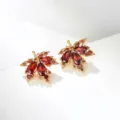 Elegant gold-toned maple leaf stud earrings with pavé red crystals for autumn style - Red Maple Leaf Short Stud Earrings