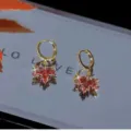 Elegant light luxury golden huggie earrings featuring sparkling red crystal maple leaf charms - Red Maple Leaf Short Huggie Earrings