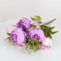 Detailed close-up of artificial peony flower bouquet petals, showing fine texture and vivid color. - Purple