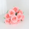 Detail shot of a 10-head pink artificial rose bouquet, perfect for romantic wedding decor. - Coral Pink