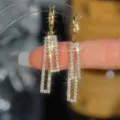 Detailed close-up of elegant sparkling gold rectangular rhinestone dangle earrings for women - Double Rectangular Long Earrings (E3196) / Gold