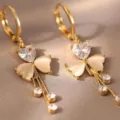 Detailed view of elegant gold-tone heart earrings with rhinestones and opal stones - Heart Cat's Eye Tassel Style (E3033) / Gold