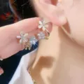 Elegant gold-tone floral earrings featuring white petals and sparkling crystals - Double Flower Linked Style (E2297 Gold White) / Gold White