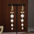 Elegant gold bow earrings with four graduated dangling white pearls for women and girls - Pearl Bow Long Tassel Style (E2351 Gold Stud) / E2351 Gold Stud