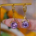 Elegant gold plated earrings featuring a purple round gemstone and sparkly halo - Round Purple Gemstone Earrings (E2524 Gold Purple)