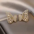 Elegant gold-tone butterfly stud earrings with sparkling crystals and white pearls. - Pave Butterfly Pearl Style (E3035) / Gold