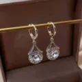 Elegant Korean style crystal drop earrings with a gold finish and sparkling stone accents - Round White Rhinestone Earrings (E2524) / Silver