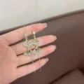 Elegant vintage gold finish dangle earrings with shimmering rhinestone gingko leaf design details - Ginkgo Leaf Tassel Ear Wires (E3061) / Gold White